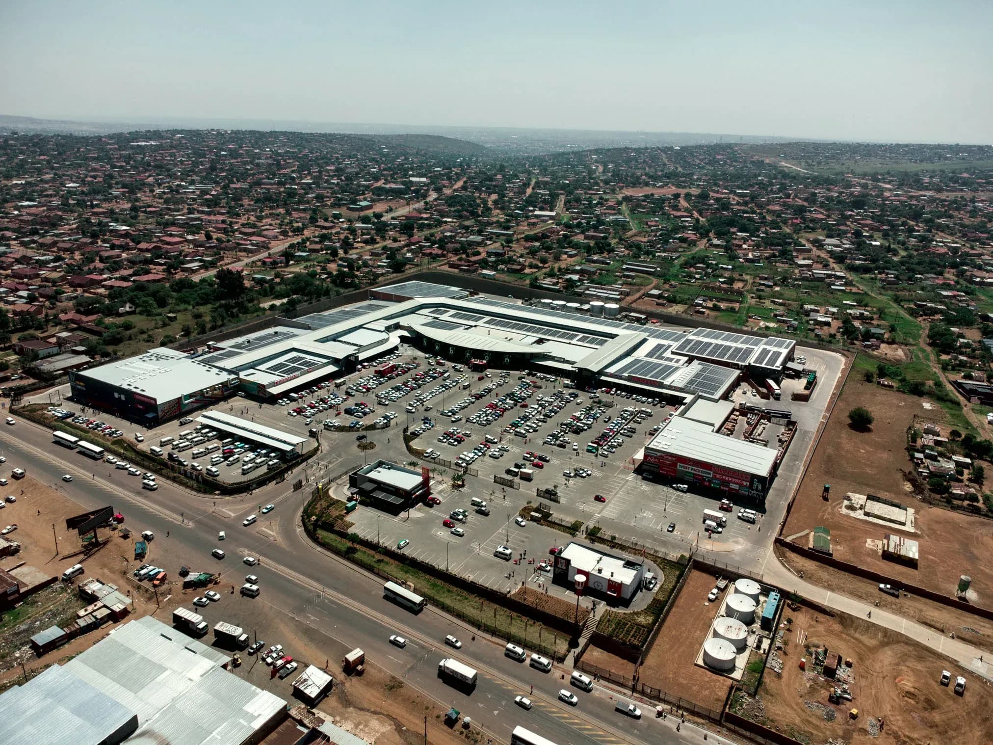 Hebron Mall from the air, solar panels across its roofs and the surrounding settlement beyond
