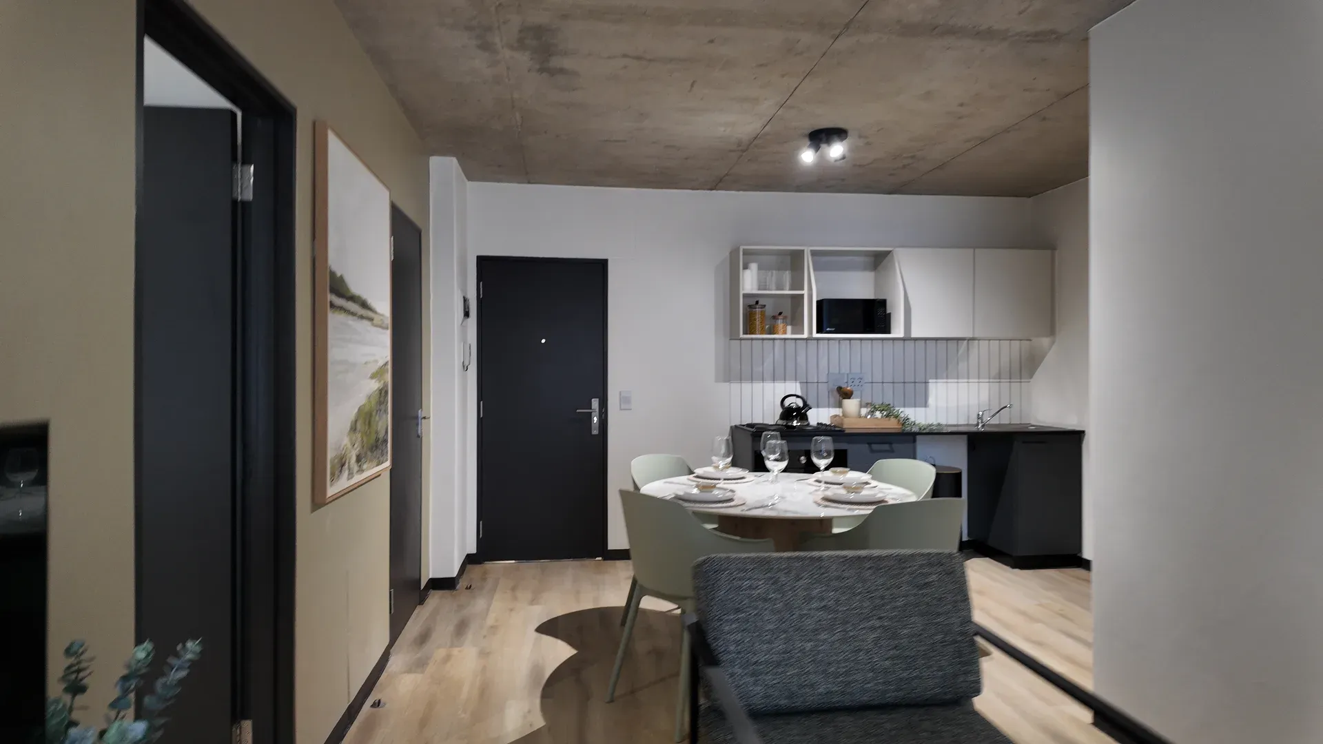 Open-plan kitchen and dining area in a Jetty Quarter apartment